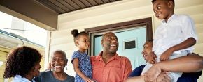 Black family happy on porch