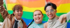 friends holding pride flags