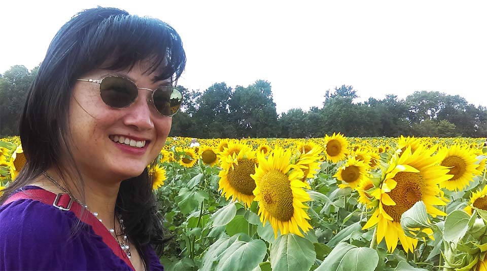 Tina Lai with sunflower fields